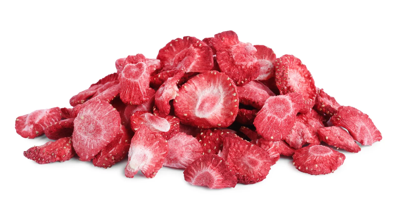 A pile of freeze-dried strawberry slices on white, cut faces showing pale dry centres and visible seeds.