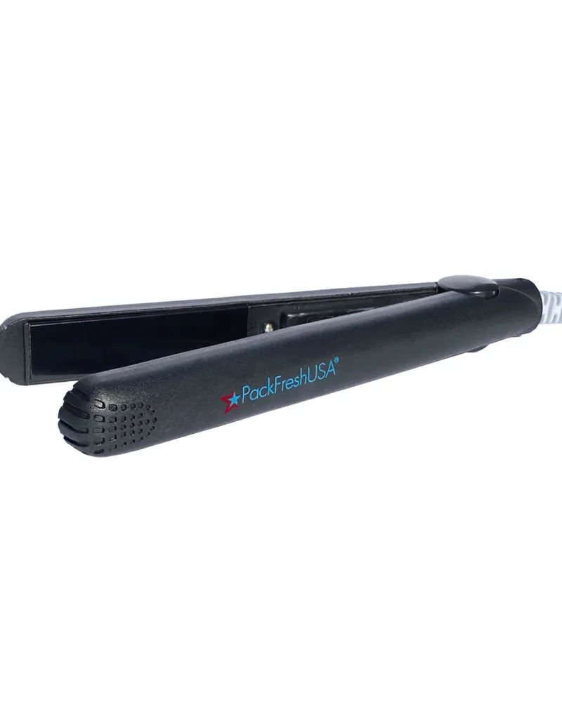 A PackFreshUSA mini bag sealer seen at an angle, jaws open, showing the heating strip.